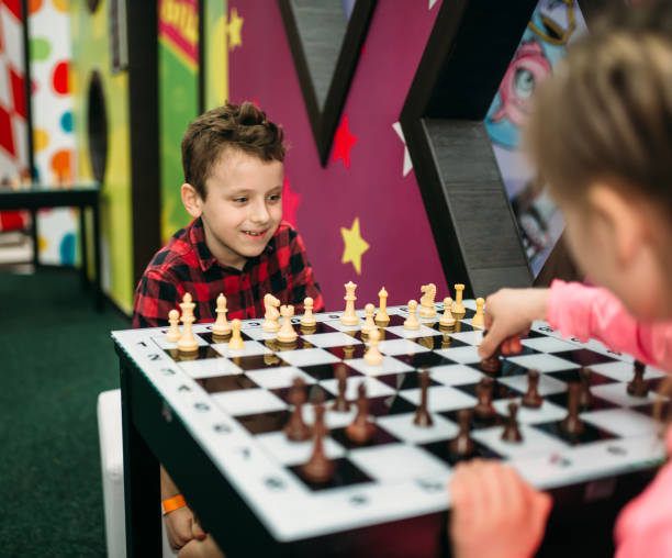 istock Little kids playing chess in entertainment center 682942952