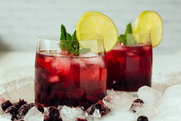 istock Berry cocktails with mint and lime in glasses 682943438