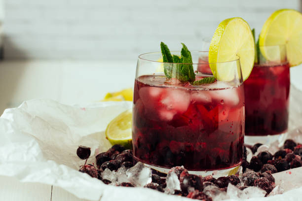 istock Berry cocktails with mint and lime in glasses 682943440