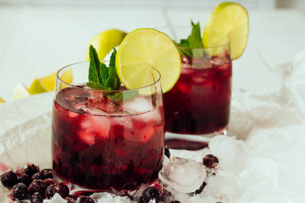 istock Berry cocktails with mint and lime in glasses 682943494