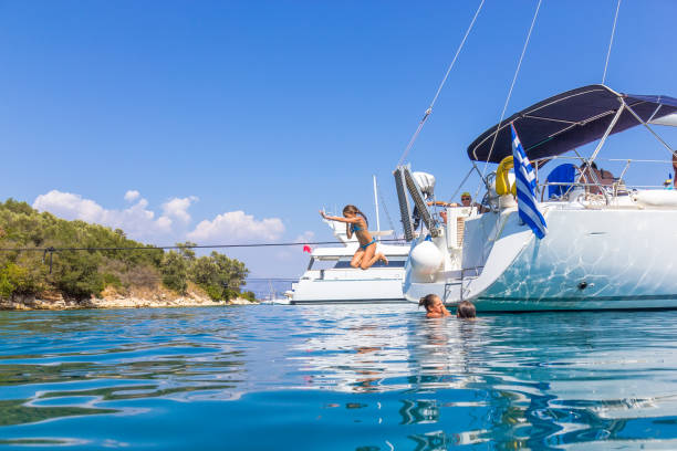 istock Children jumping from the sailboat 682944192