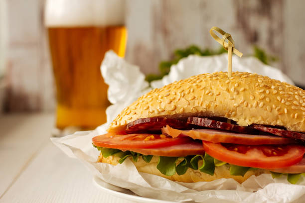 istock Sandwich with ham, sausage and tomato 682944460