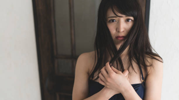 istock Young woman posing with keeping her hair by hands 682944512