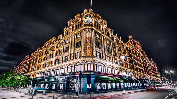 night harrods London, UK - May 12, 2017:Famous London landmark Harrods in the night harrods photos stock pictures, royalty-free photos & images