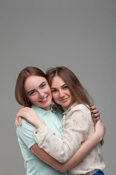 istock Two happy girlfriends hugs together 682951508