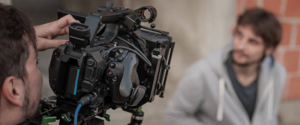 istock Behind the scene. Actor in front of the camera 682954390