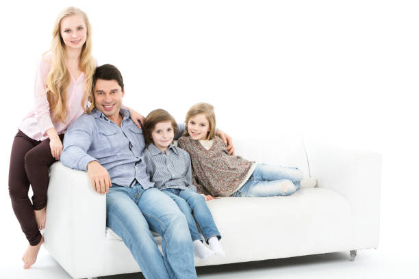 istock Family sitting together on the couch isolated. 682965200