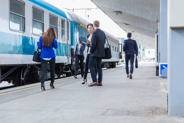 istock Business people on a railroad station waiting for train 682968812
