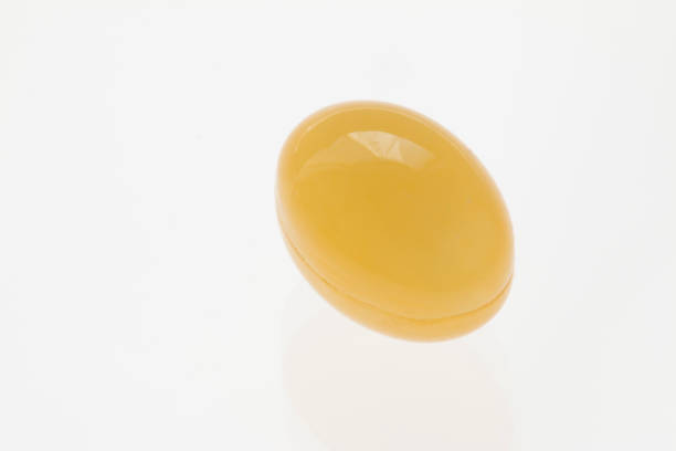 istock yellow soft gel capsule on white background 682971612