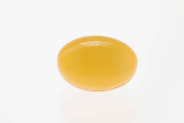 istock yellow soft gel capsule on white background 682971644