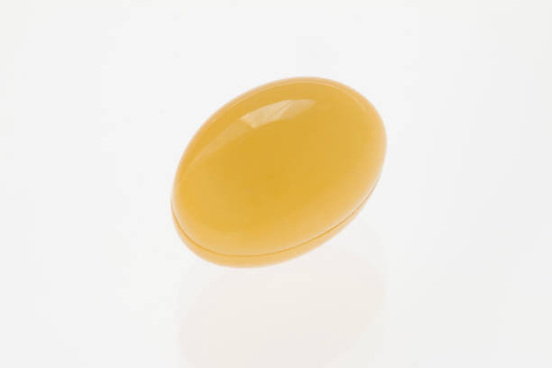 istock yellow soft gel capsule on white background 682971680