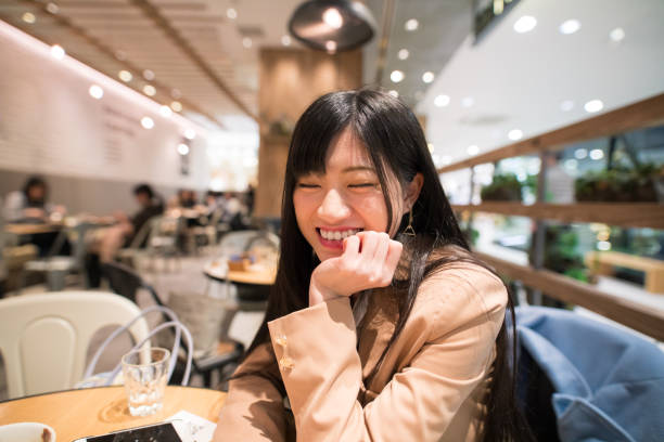 Happy young woman in cafe