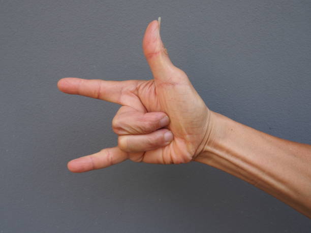istock a hand making love sign on gray background 682985950