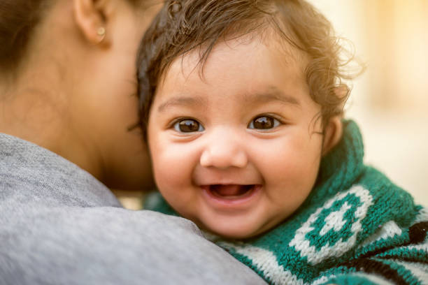Indian woman with her newborn daughter