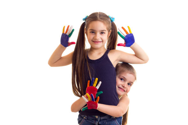 istock Little girls with colored hands 682986812