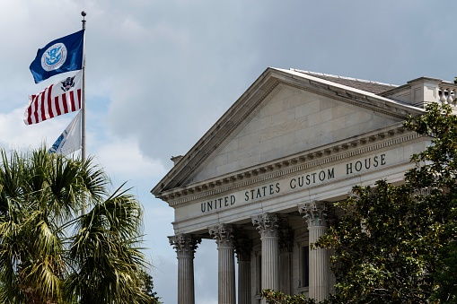 The neo classical facade of the United States Customs House in Charleston, South Carolina. Charleston is a major port city on the east coast of the US.