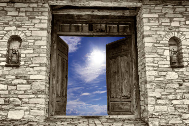 Open old door to sky Stone - Object, Stone Material, Brick, Wall - Building Feature, Rock - Object, Old, Oil lamp, Door, Sky old oil lamp stock pictures, royalty-free photos & images