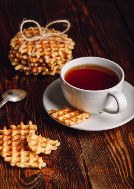 istock Cup of Tea and Belgian Waffles for Dessert. 682996414