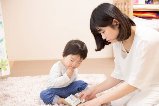 istock Young woman holding a child 682996912