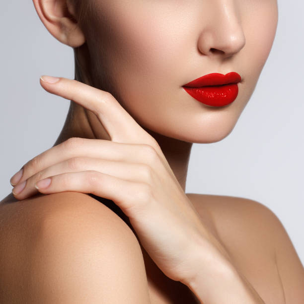 istock Beautiful young model with red lips and french manicure 683035208