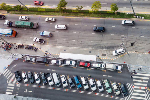 istock vertical aerial view over car parking place near the road 683035810