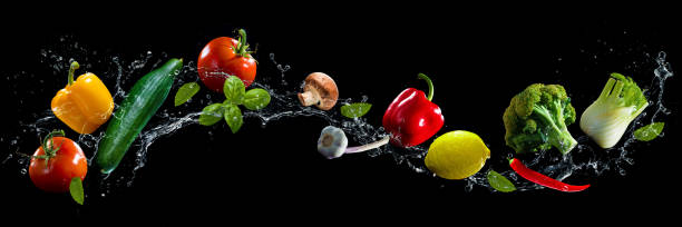 vegetables water splash - cooking process imagens e fotografias de stock