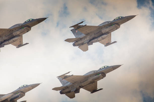 RADOM, POLAND - AUGUST 23:  Group formation "F-16" at blue sky during at Air Show Radom 2015 event on August 23, 2015 in Radom, Poland RADOM, POLAND - AUGUST 23:  Group formation "F-16" at blue sky during at Air Show Radom 2015 event on August 23, 2015 in Radom, Poland nato stock pictures, royalty-free photos & images