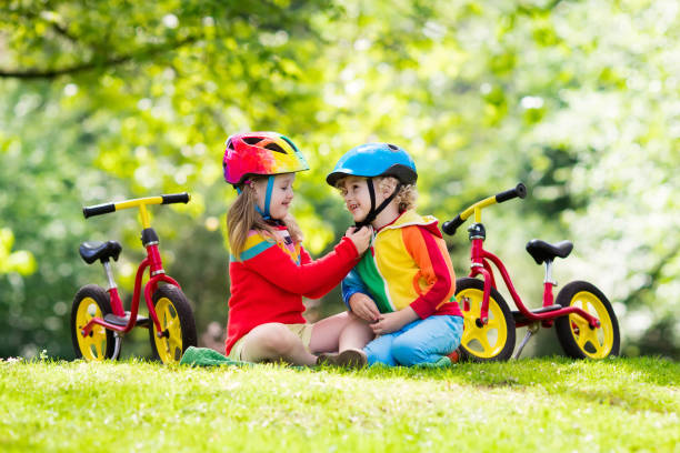 istock Kids ride balance bike in park 683054158