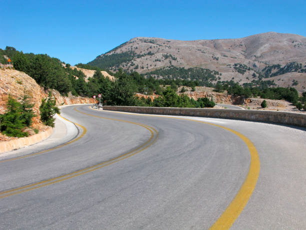 istock Winding road in mountains, yellow marking 683054618