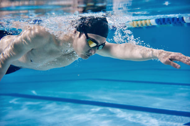 istock Male swimmer swimming underwater in a pool 683054700
