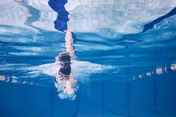 istock Male swimmer swimming underwater in a pool 683054848