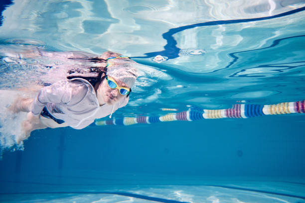 istock Male swimmer swimming underwater in a pool 683054852