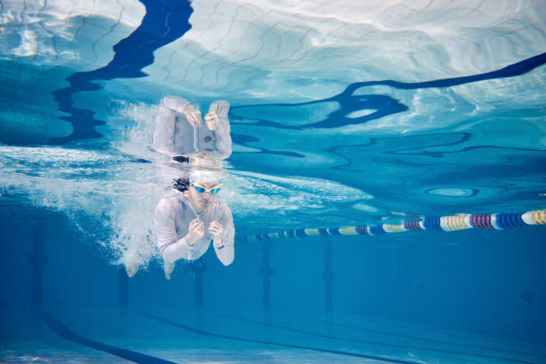 istock Male swimmer swimming underwater in a pool 683054862