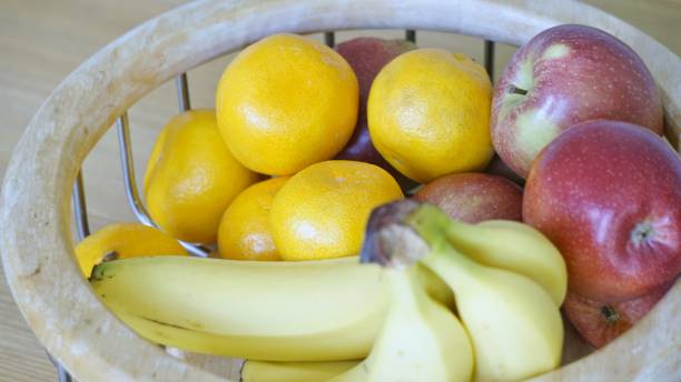 istock Apples, Bananas and Satsumas in Fruit Bowl. 683054890