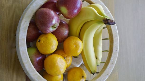 istock Apples, Bananas and Satsumas in Fruit Bowl. 683054926