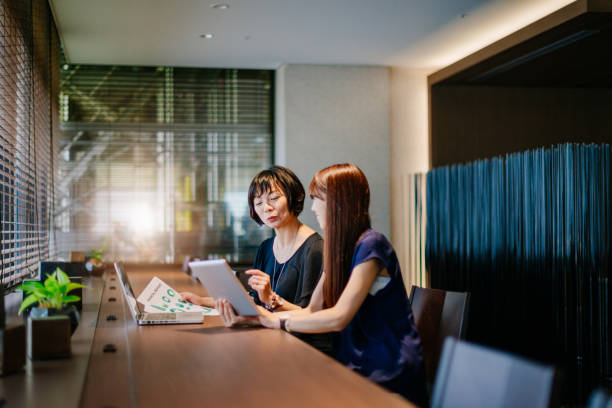 istock Businesswomen in Japan using latest software solutions for market performances 683061030