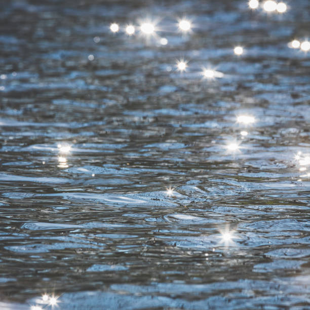 istock Glittering sun in the surface of the ocean 683061286