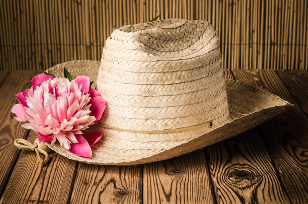 istock Straw hat and peony flower, close-up 683061418