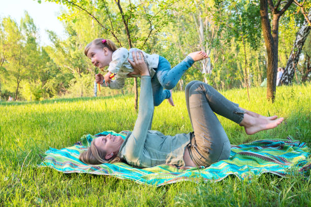 istock Happy mother with her little daughter are playing cheerfully i 683064634