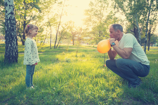 Ankara/Turkey-June 23 2019: Dad buying balloon for his daughter. Concept of dad and daughter. For ladies, for girls.