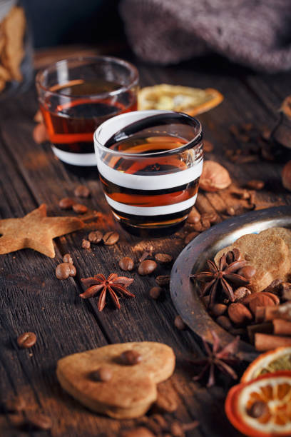 istock Whiskey or liqueur, cookies, spices and decorations on wooden background. 683070970