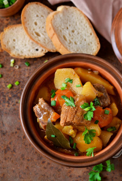 istock Stew with vegetables and potatoes on an old grunge background 683073126