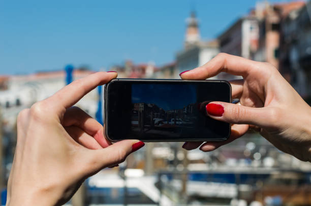 istock girl taking photo with cellphone 683074058