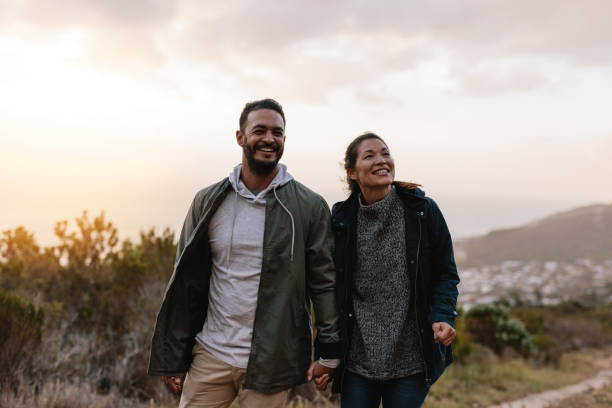 istock Happy hikers walking in the countryside 683074512