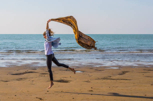 istock girl having fun at the sandy beach 683074516