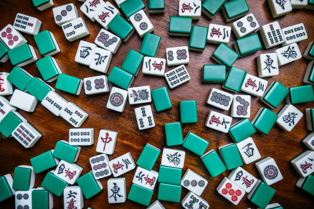 istock Full of Mahjong tiles game on darkwood table background 683077604