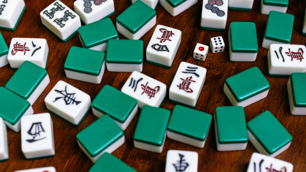 istock Full of Mahjong tiles game on darkwood table background 683077614