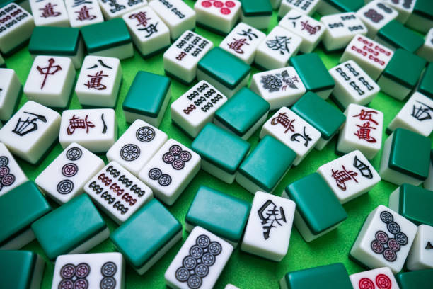istock Full of Mahjong tiles game on green background 683077618