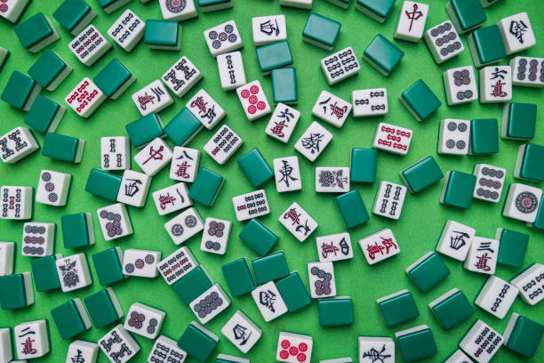 istock Full of Mahjong tiles game on green background 683077698