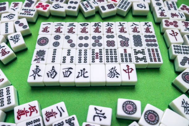 istock Full of Mahjong tiles game on green background 683077768